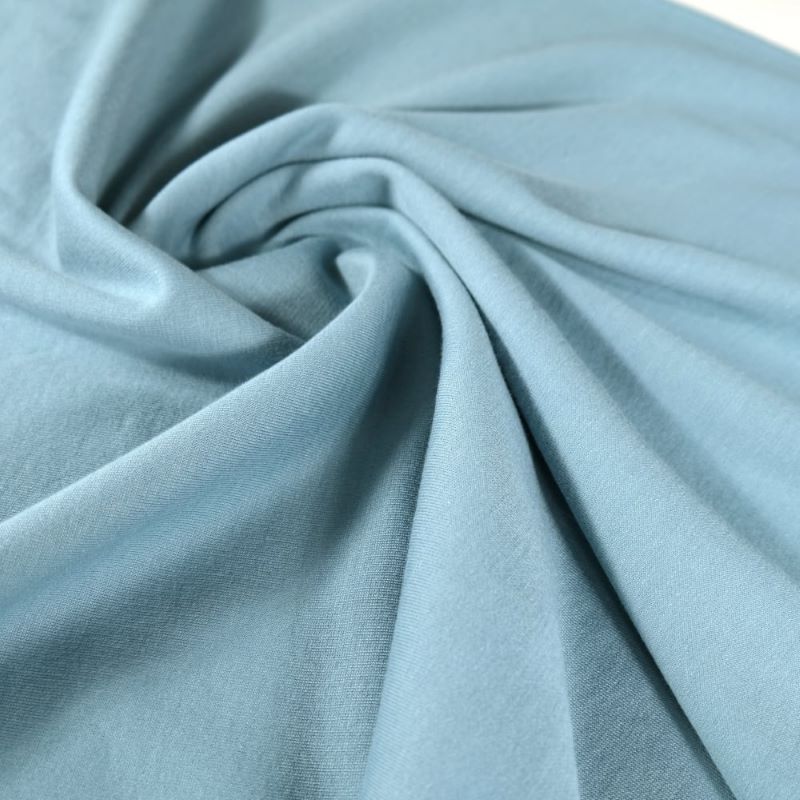 くすんだ青色をした柔らかいストレッチ素材の布地