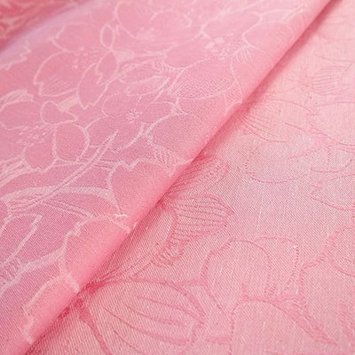 表裏が異なるピンク色の桜模様の布地